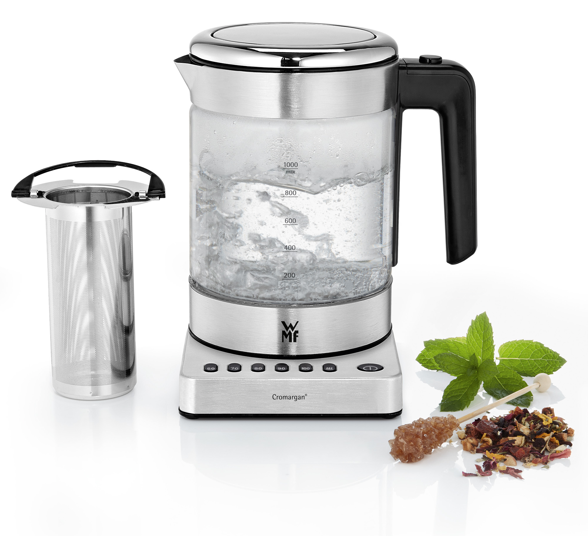 WMF glazen waterkoker met kokend water, thee-ei, thee en munt.