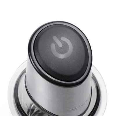 Close-up of a black power button on a stainless steel top.