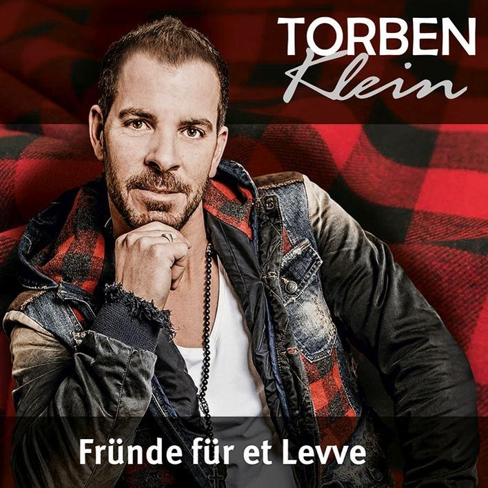 Albumcover mit Torben Klein. Mann mit Bart, trägt Jacke und Hemd.