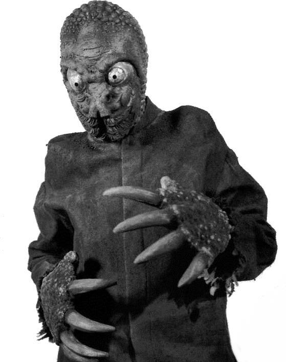 Monster in schwarzem Anzug mit Klauen, starrt den Betrachter an.