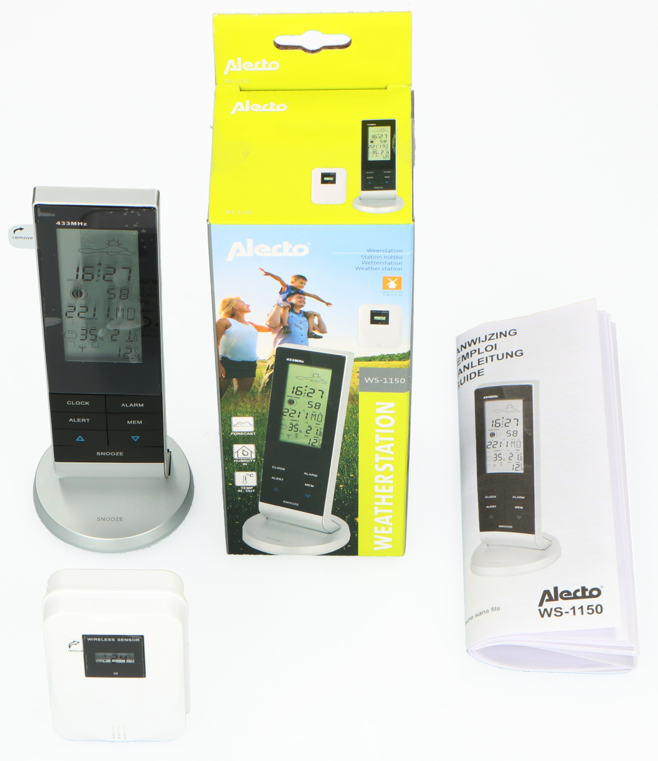 Weather station set with a display, a sensor, and a manual, against a white backdrop.