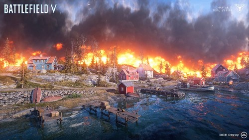Escena del juego Battlefield V. Edificios en llamas y agua en primer plano. Un muelle en el agua.