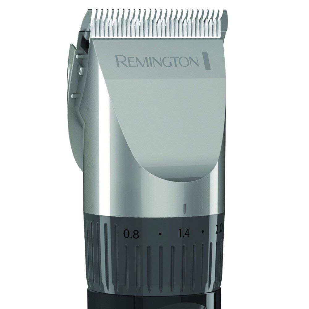 Close-up of a Remington hair clipper. The blade is silver with the word Remington on it.