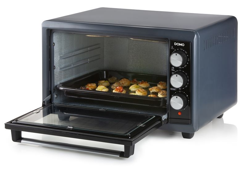 Open oven with a tray of pastries.