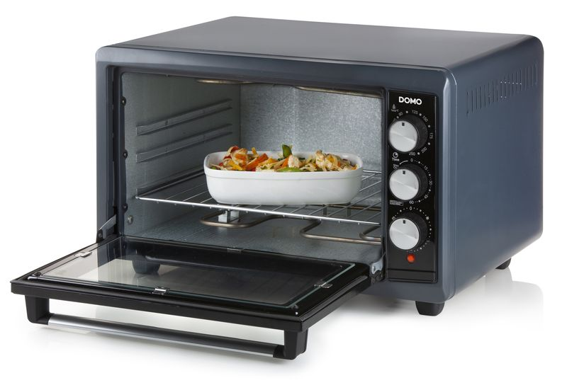 An open grey oven with a baking dish inside. It has three knobs and a red indicator light.