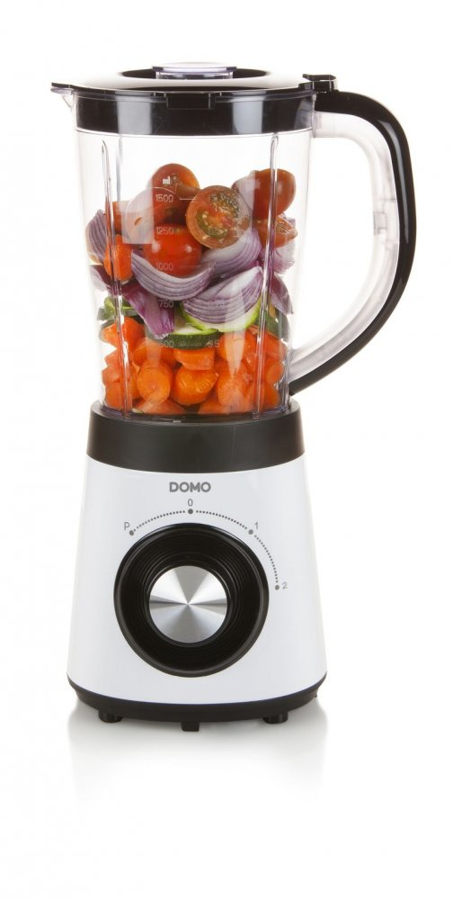 Blender avec légumes. Carottes, oignons et tomates sont visibles. Design noir et blanc.