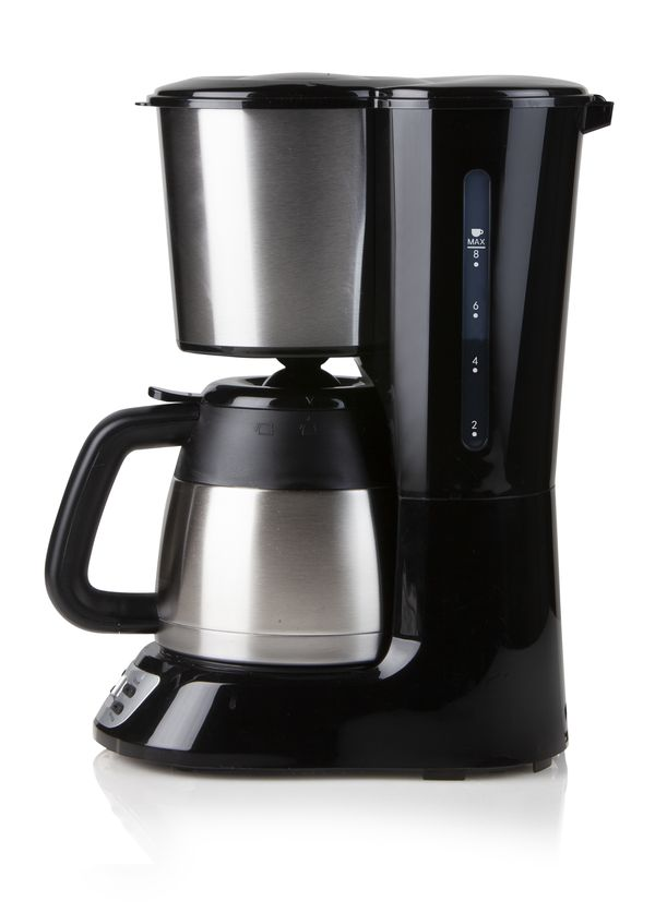 A black coffee maker with a stainless steel carafe and a black handle. It is on a white surface.
