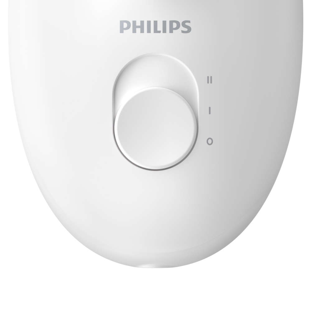 Egy fehér Philips borotva közeli képe. Egy tárcsa három beállítással.