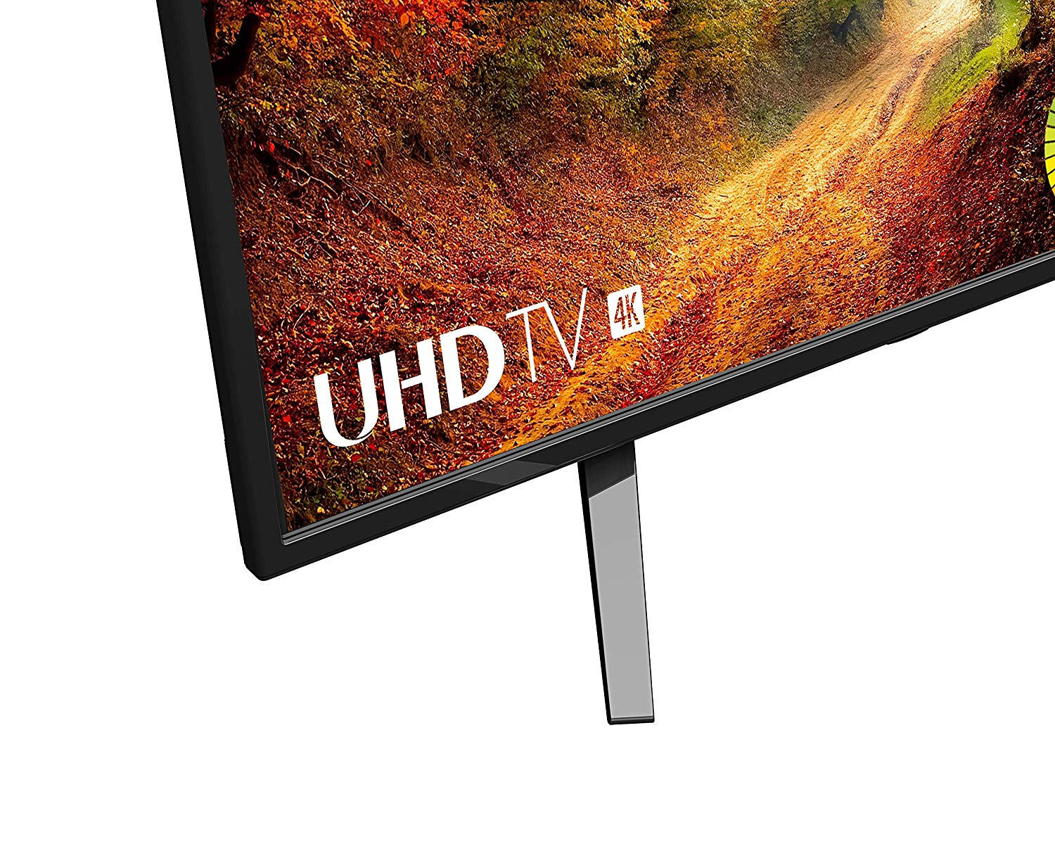 Esquina de un televisor mostrando una imagen colorida, con etiqueta UHD TV 4K, sobre fondo blanco.