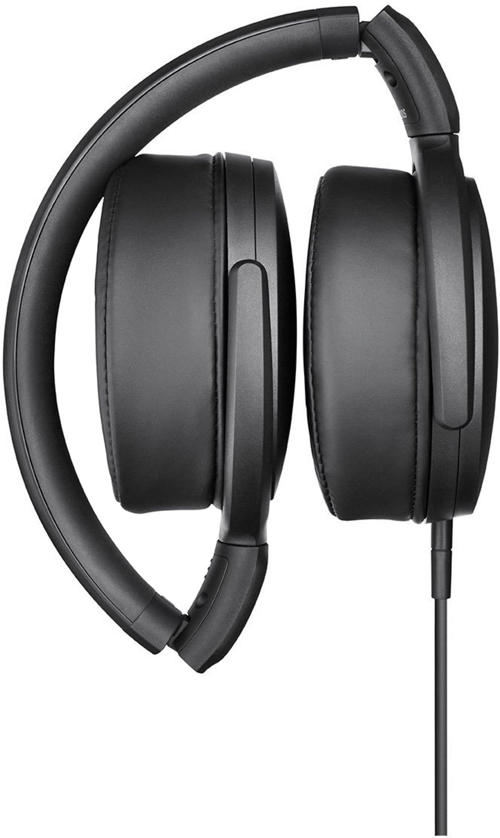 Folded black headphones with a cable. Black background.