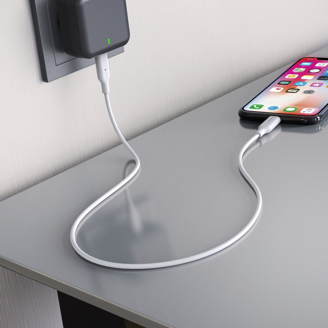 A phone connected to a charger on a table, with a white cable.