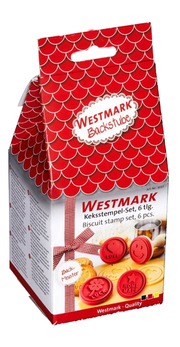 Piros tetejű Westmark süteménybélyegző doboz különböző formákkal és szalaggal.