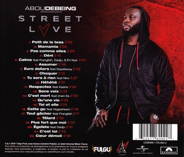 CD album back cover with text and a photo of a man.
