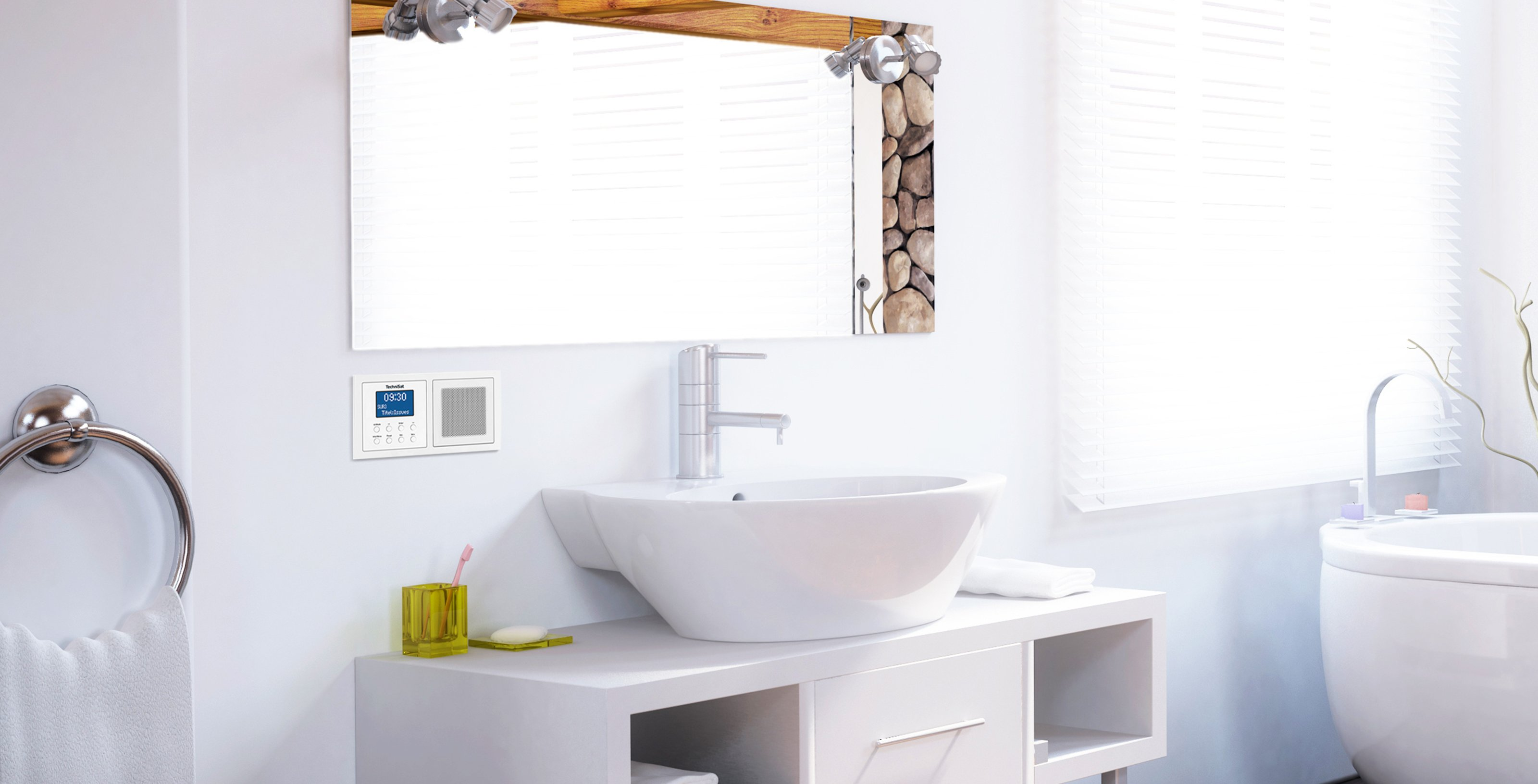 Bathroom with a sink, mirror, and a radio on the wall.