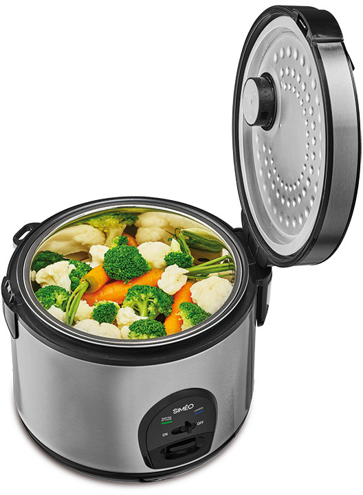 Rice cooker with vegetables inside, open lid, stainless steel exterior, and black accents.