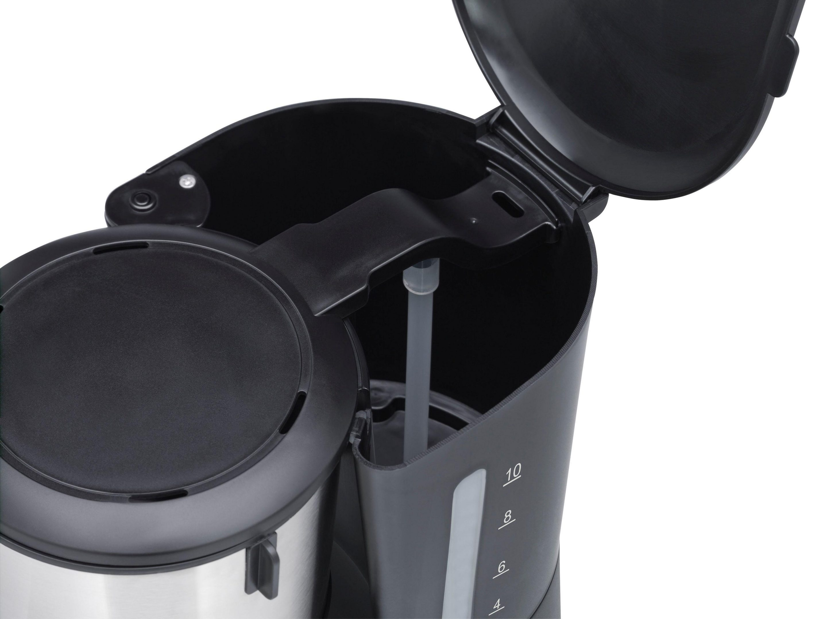 Draufsicht auf eine schwarz-silberne Kaffeemaschine mit offenem Deckel, zeigt das Innere.
