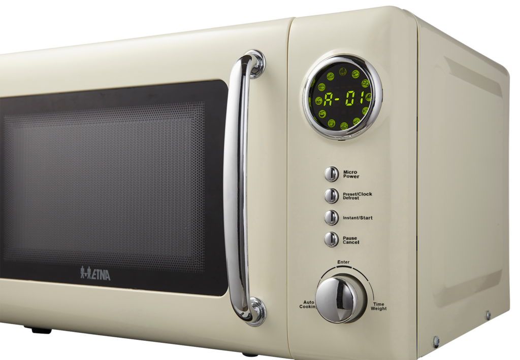 Ivory microwave with handle and control panel, showing a digital display. Buttons include micro power and time weight.