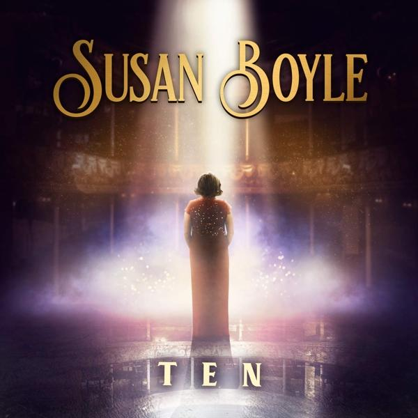 Susan Boyle albumhoes. Podiafbeelding met schijnwerper en het woord 'TEN'.