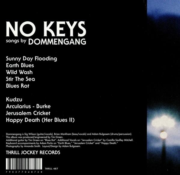 Rückseite eines Dommengang-Albums mit Songtiteln und Text.