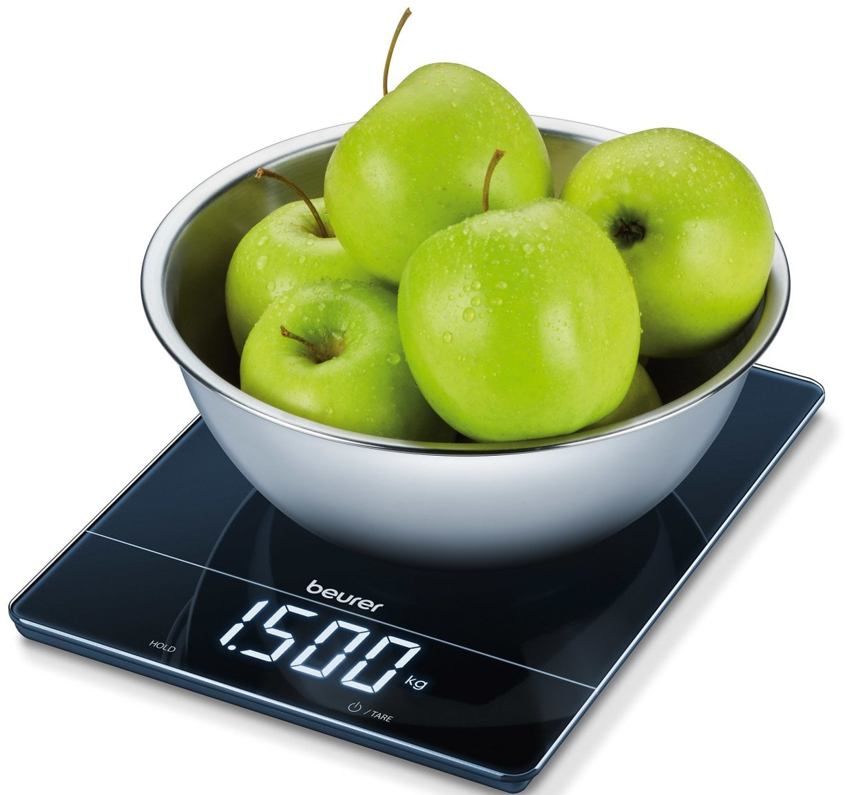 Pommes vertes dans un bol en acier sur une balance numérique. La balance affiche 1500 kg.