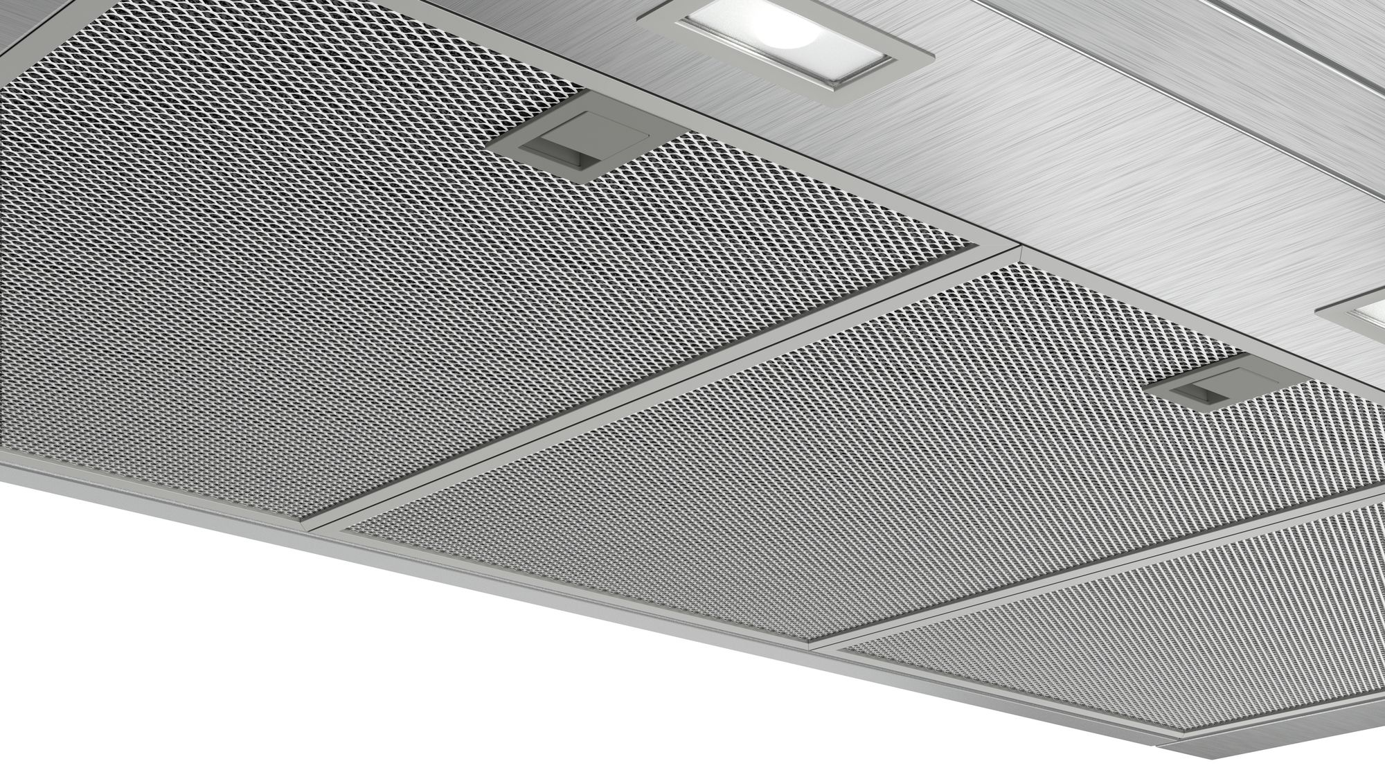 Primer plano de una campana de cocina con rejilla metálica y luces.