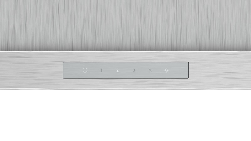 Panel de control plateado con botones 1, 2, 3, arriba y un altavoz.