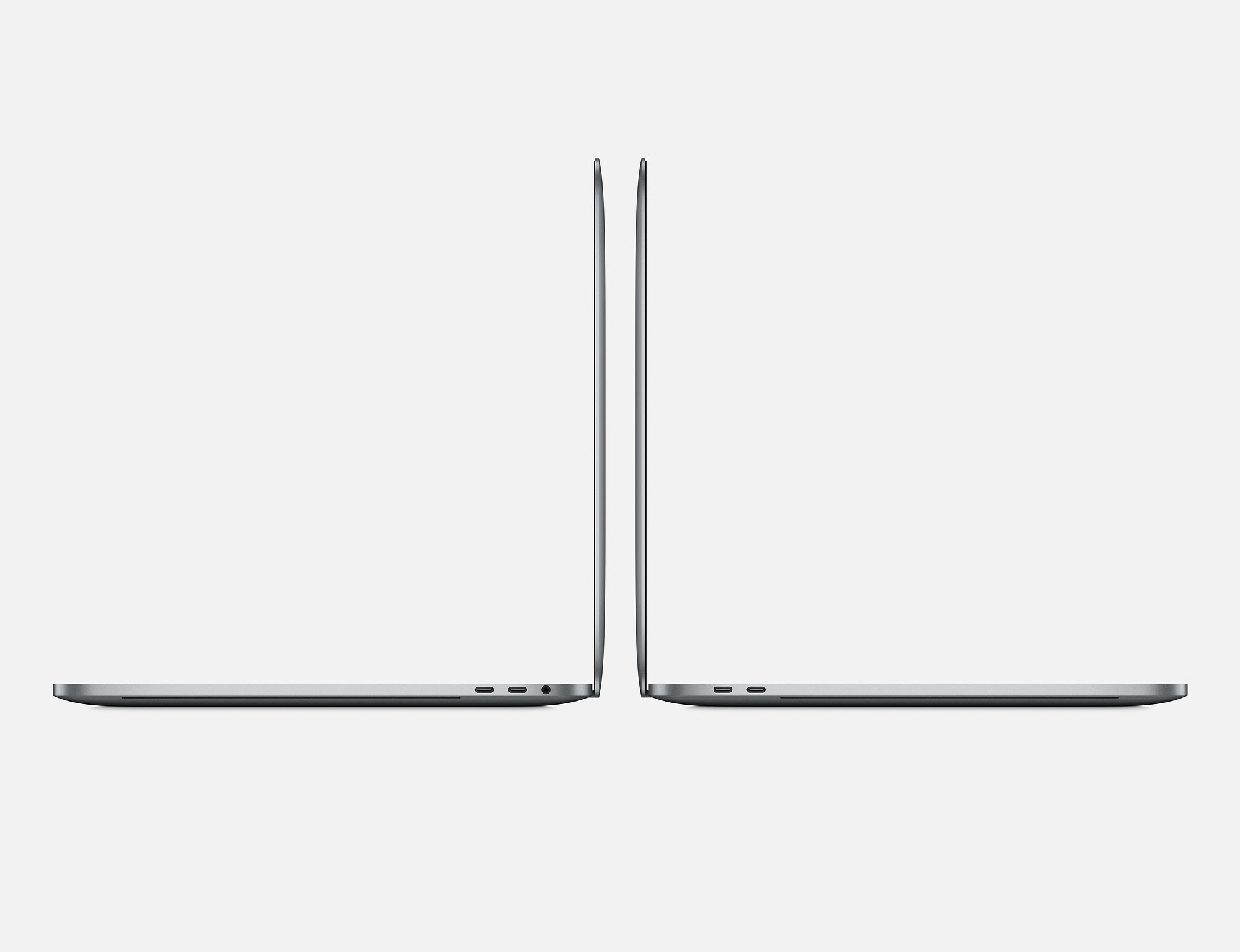 Zwei graue Laptops nebeneinander, Seitenansicht, die Kanten und Anschlüsse zeigen. Weißer Hintergrund.