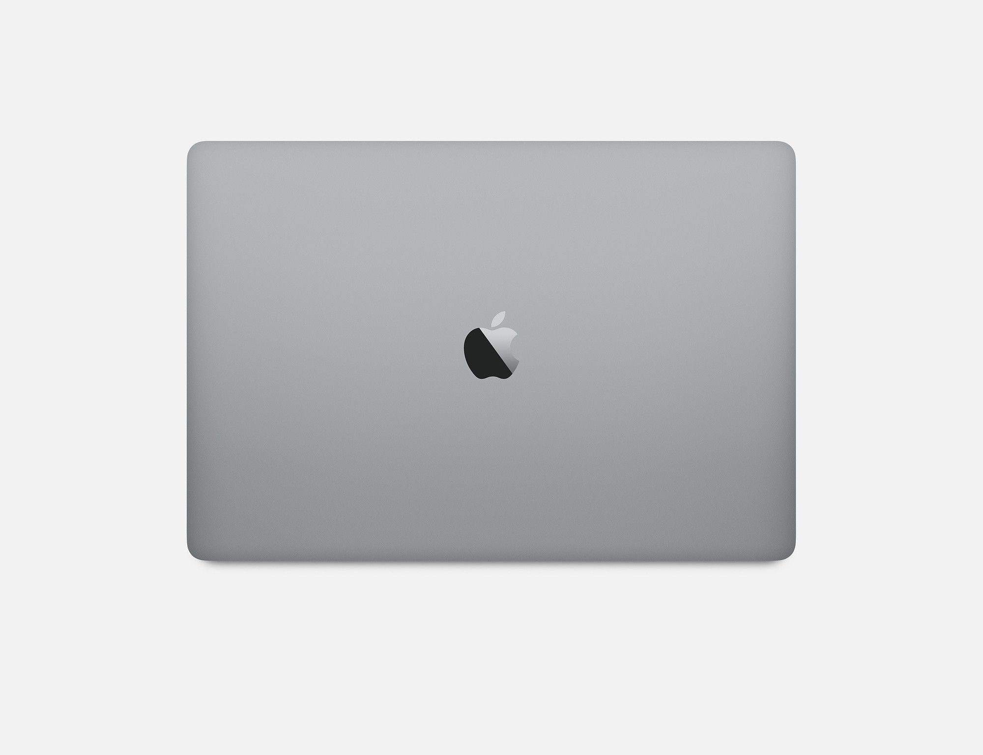 Draufsicht auf einen geschlossenen silbernen Laptop mit Apple-Logo auf weißem Hintergrund.