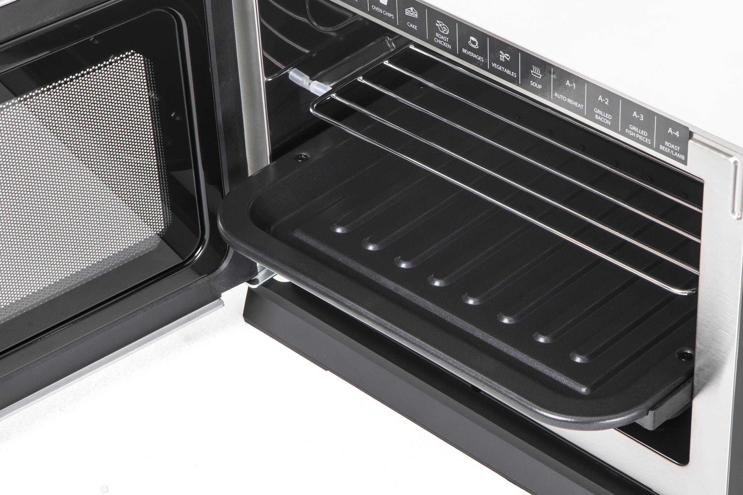 Microwave interior with rack and tray, open door, visible control panel.