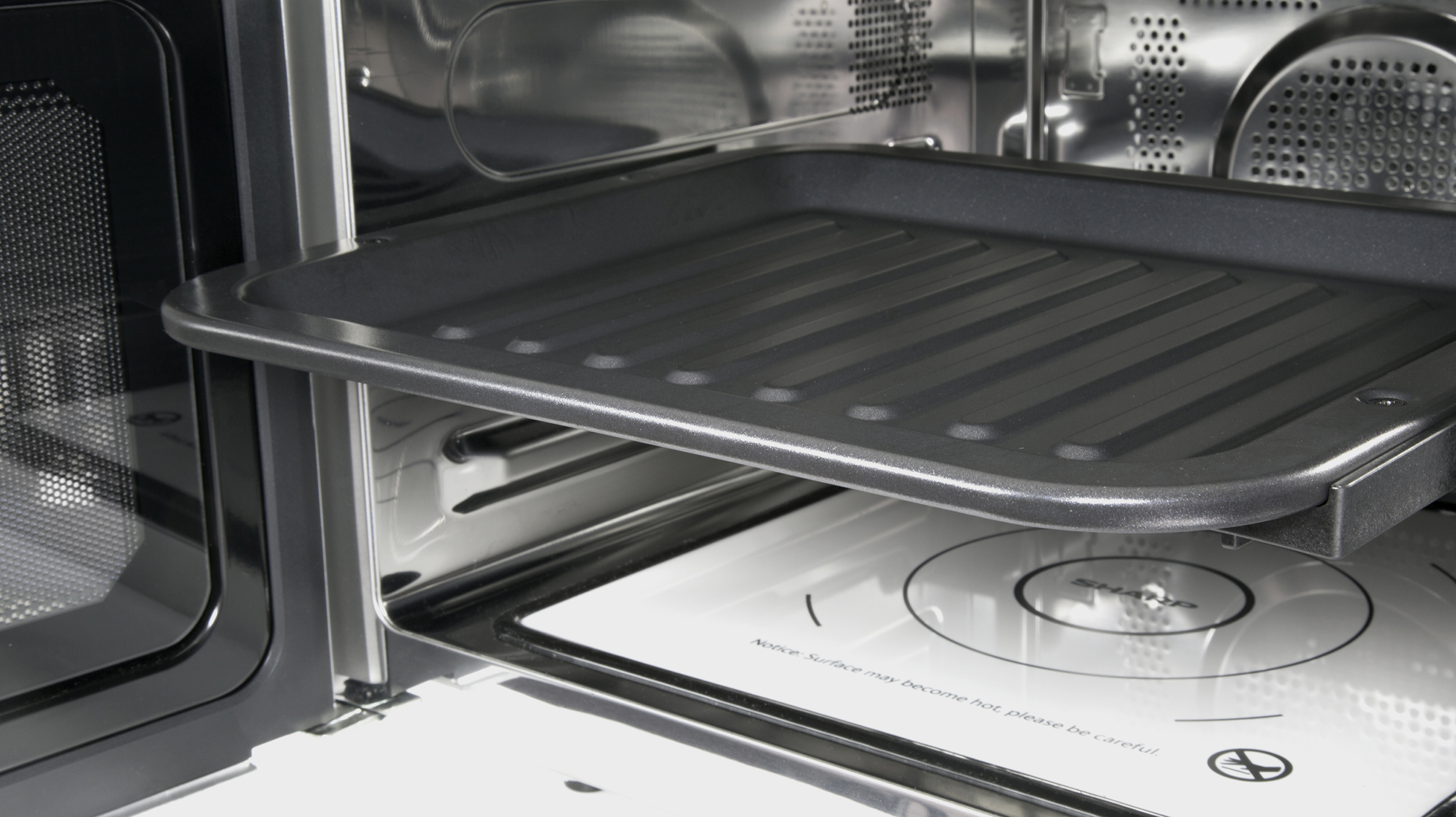 An oven with a tray inside.