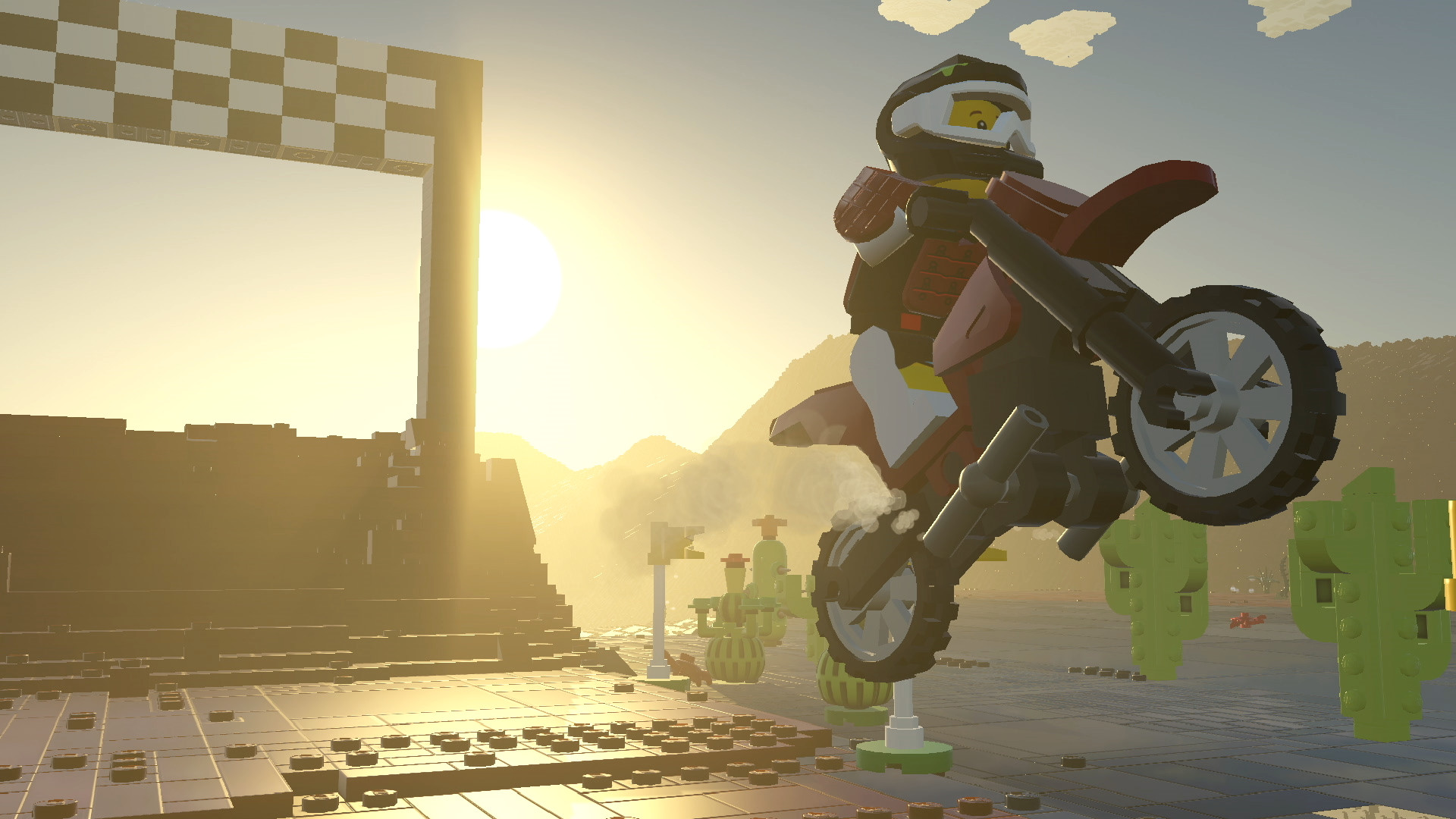 Lego-Figur auf einem Motorrad springt in einer Lego-Umgebung mit karierter Ziellinie.