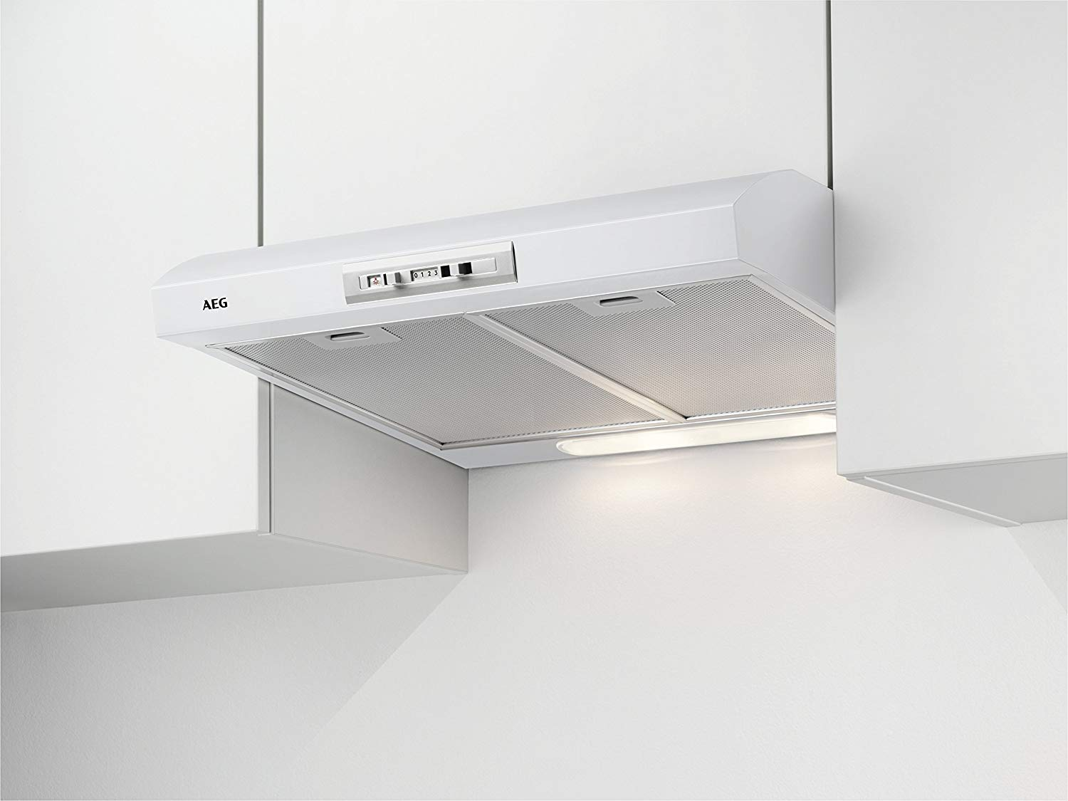 White kitchen hood mounted on the wall, lights and controls visible.