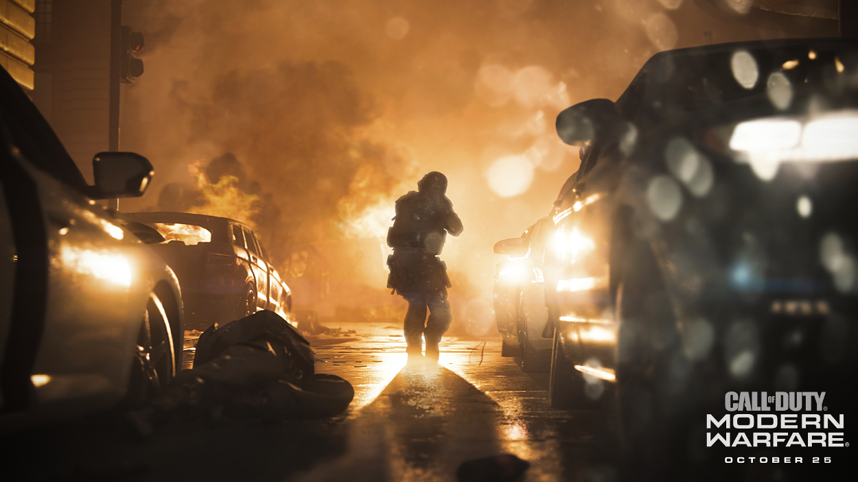 Scene uit 'Call of Duty: Modern Warfare'. Een soldaat loopt door een door oorlog geteisterde stad met auto's en explosies.
