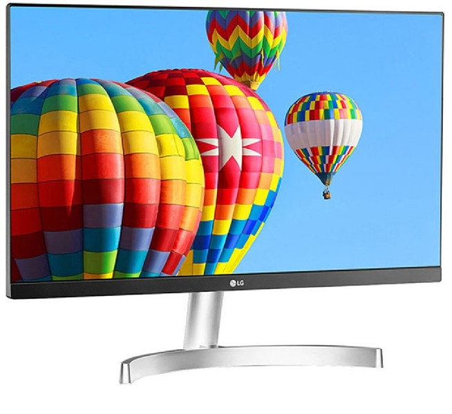 Un monitor de ordenador que muestra tres globos aerostáticos de colores contra un cielo azul.