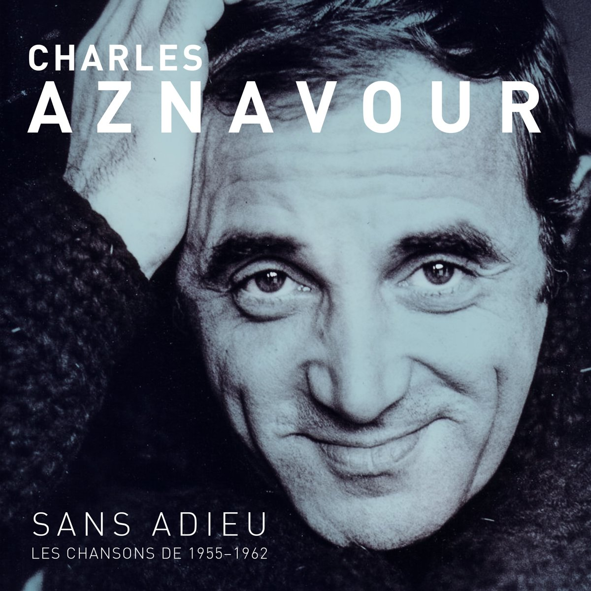 Pochette de l'album de Charles Aznavour. Portrait en gros plan de lui souriant avec le texte 'Sans Adieu'.