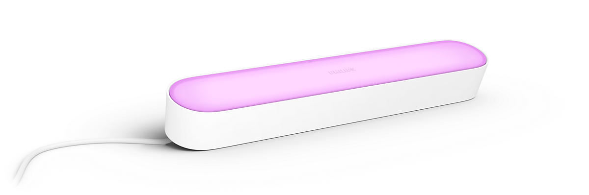 A white Philips Hue light bar, emitting pink light. It has a white base and a white power cord.