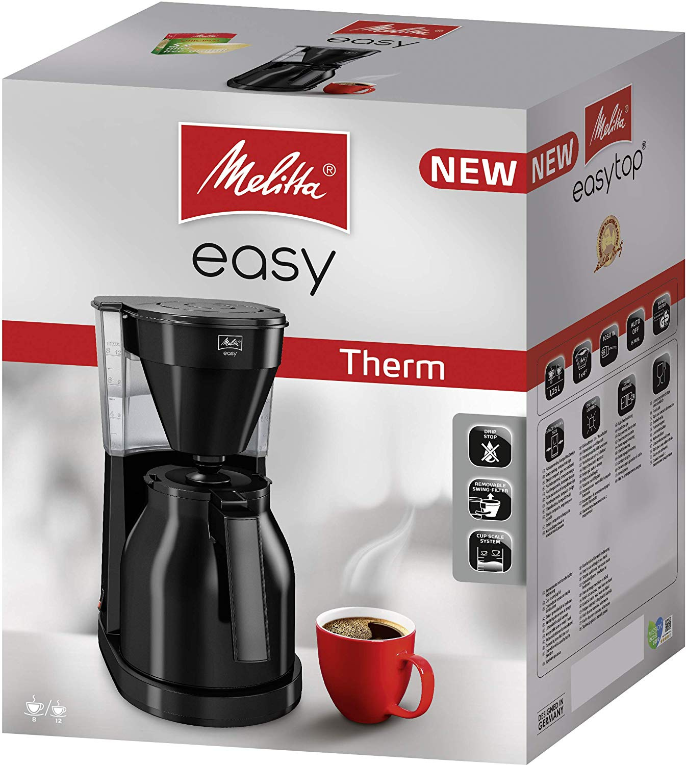 Una macchina da caffè Melitta easy top è in una scatola con una tazza di caffè rossa davanti.