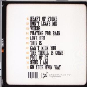 CD-Cover mit Titelliste: Heart of Stone, Don't Leave Me, Weeds, Praying For Rain und andere.