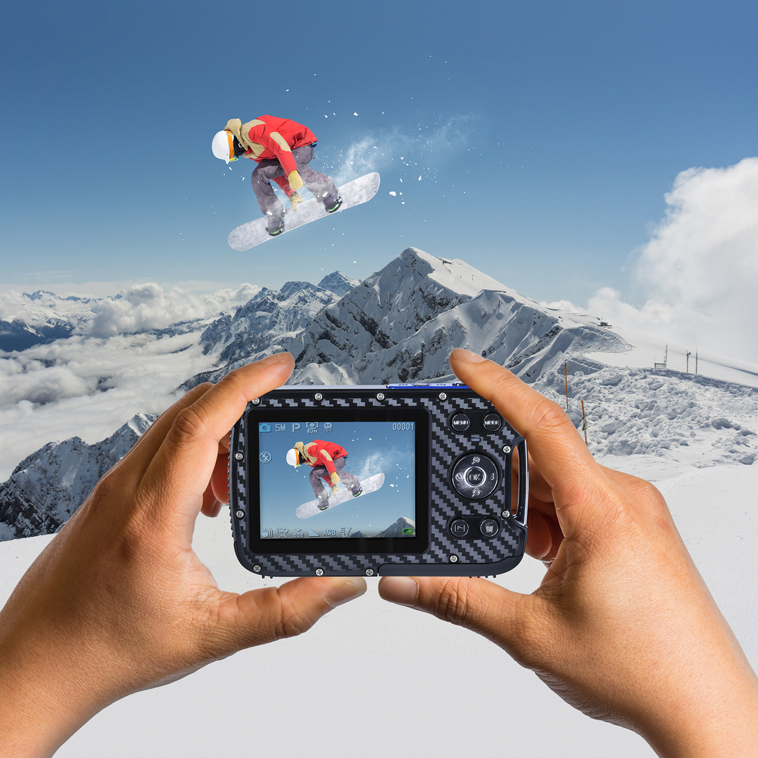 Handen die een camera vasthouden, waarop een snowboarder springt.