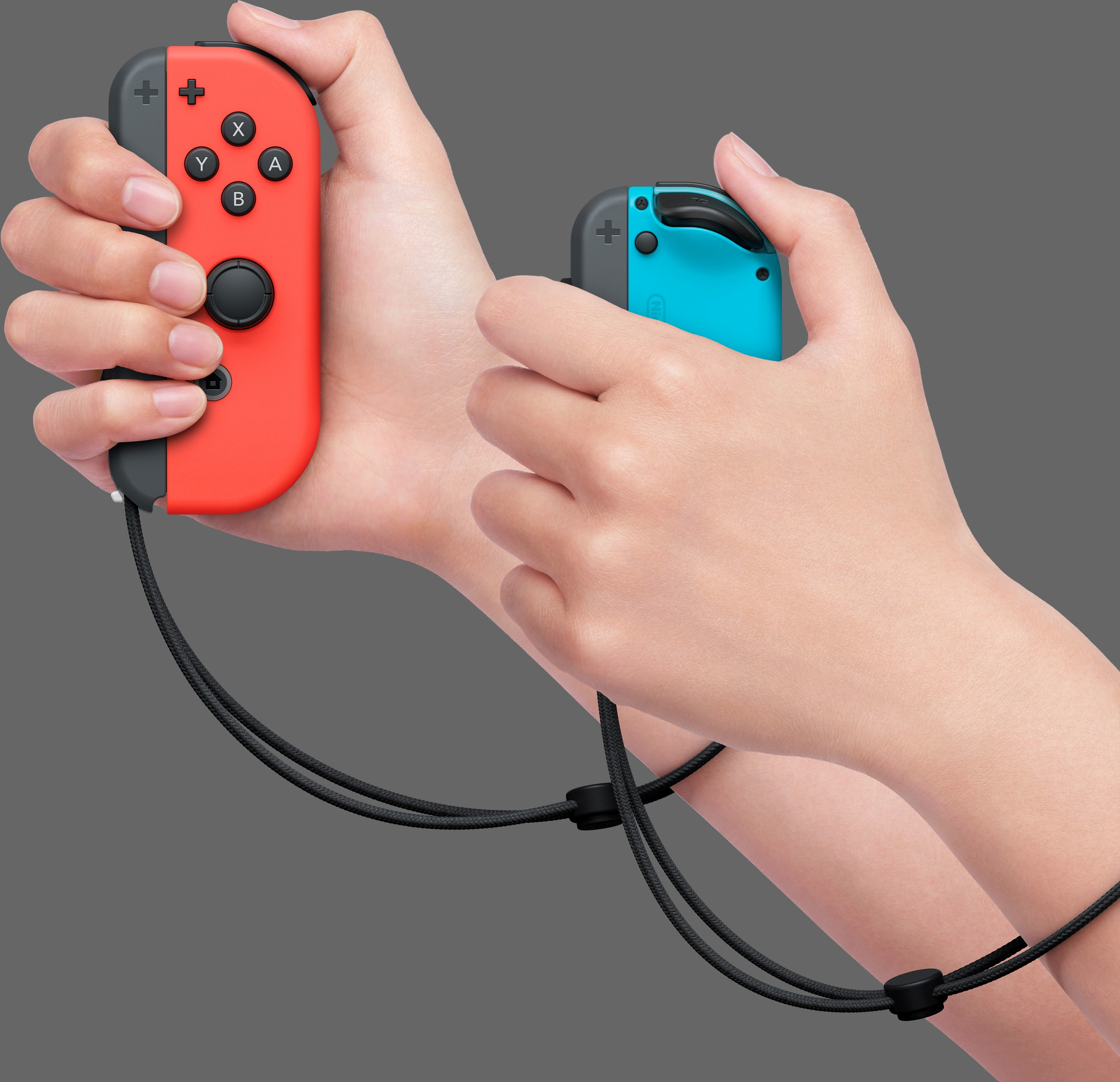 Zwei Hände, die rote und blaue Nintendo Switch-Controller halten.