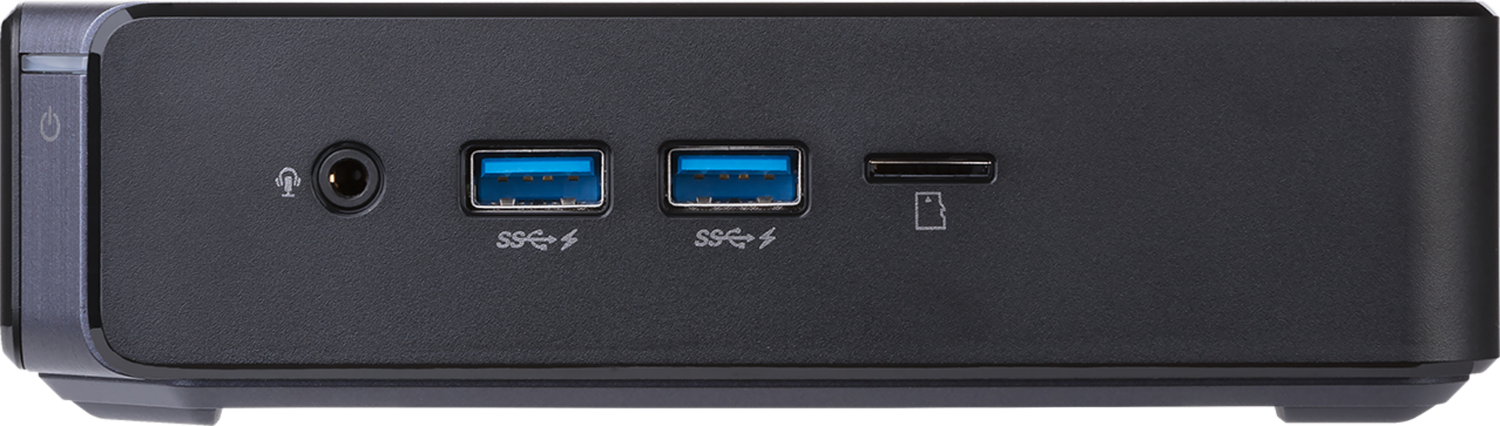 Vista frontal de una pequeña computadora gris oscuro con puertos. USB, audio y ranura para tarjetas.