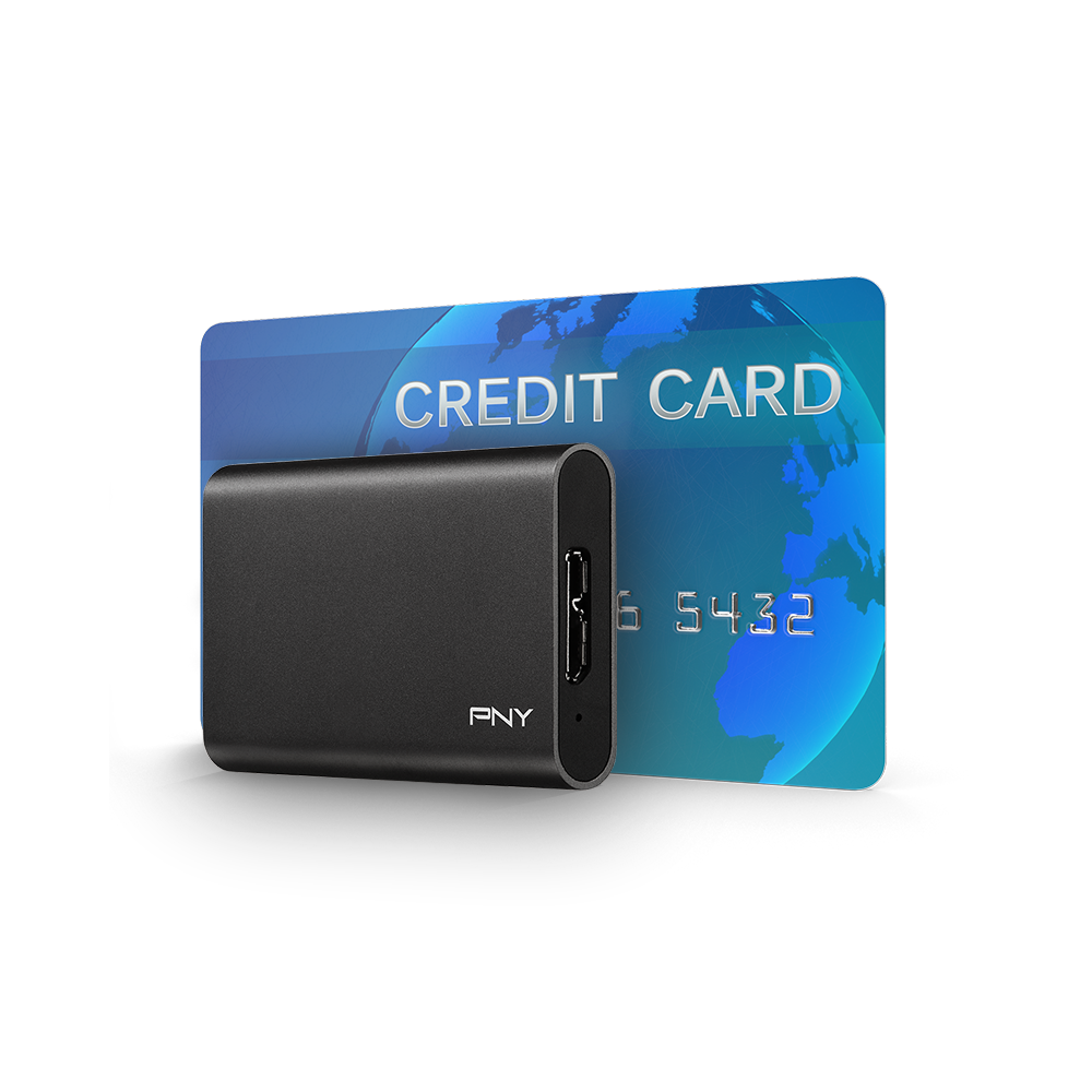 A black PNY external hard drive is in front of a credit card. The card is blue and has the words "CREDIT CARD" on it.