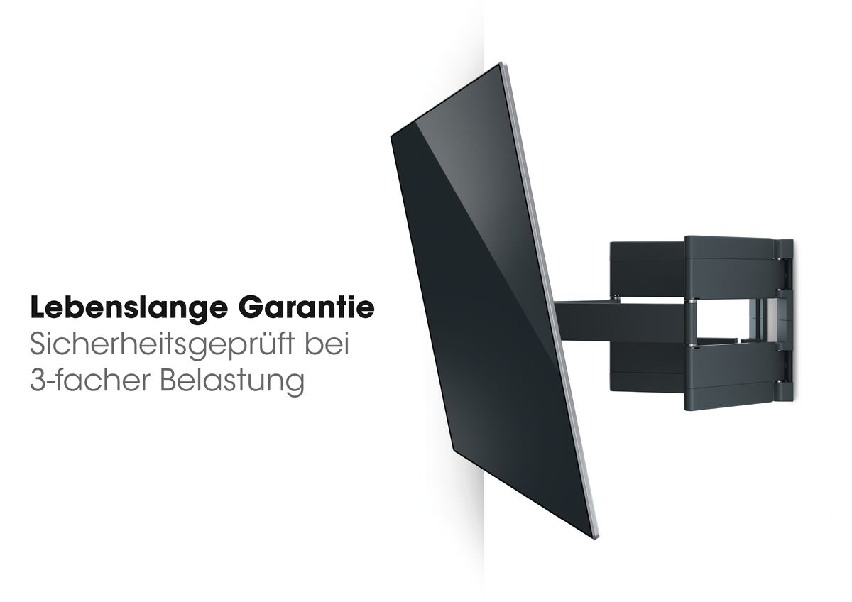 An der Wand montierter Fernseher mit Text über Garantie und dreifache Belastung.