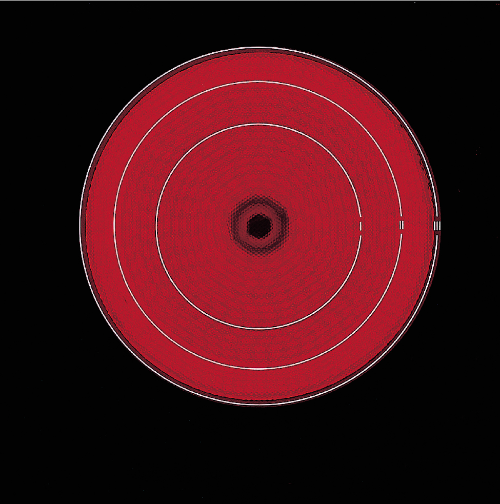 Vue de dessus d'une plaque de cuisson, avec des cercles rouges concentriques et un fond noir.