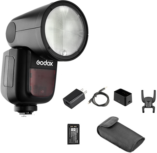 Flash Godox avec accessoires. Comprend chargeur, câbles et étui souple.
