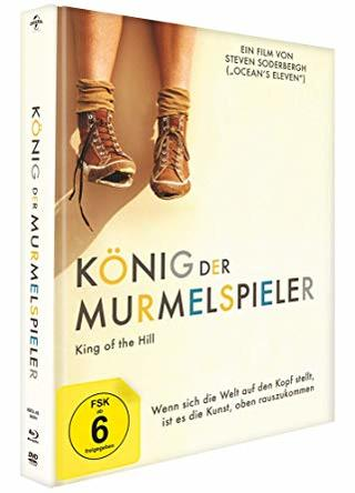 DVD-Cover: König der Murmelspieler. Zeigt ein Paar Stiefel und Filmtitel.