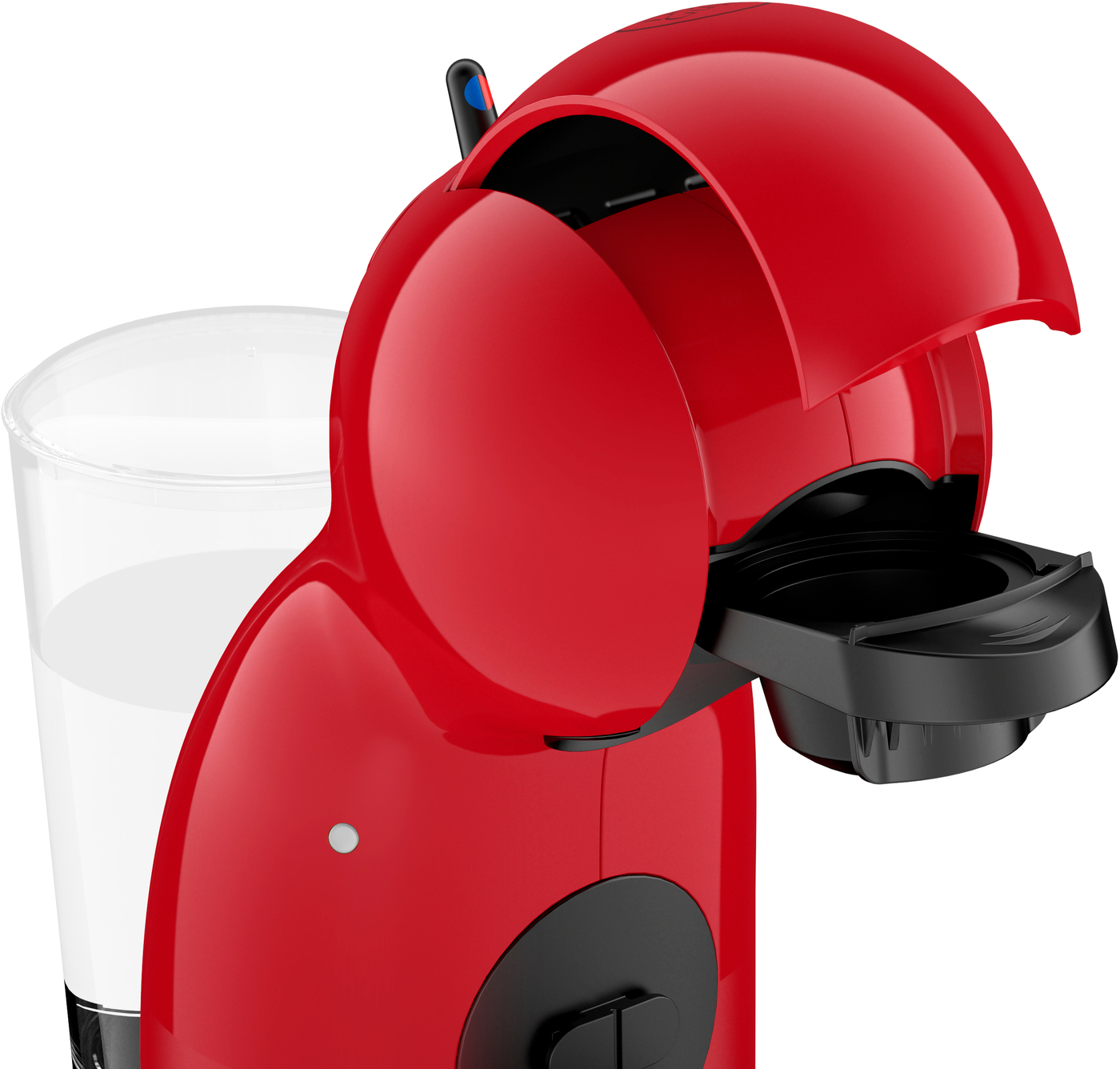 Une machine à café rouge avec un dessus ouvert, un porte-capsule noir et un verre rempli de liquide.