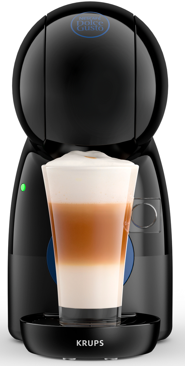 Een zwarte koffiemachine met een glas latte macchiato ervoor.