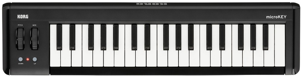 Teclado Korg microKEY negro. Tiene teclas blancas, ruedas de tono/mod y luces rojas/azules.