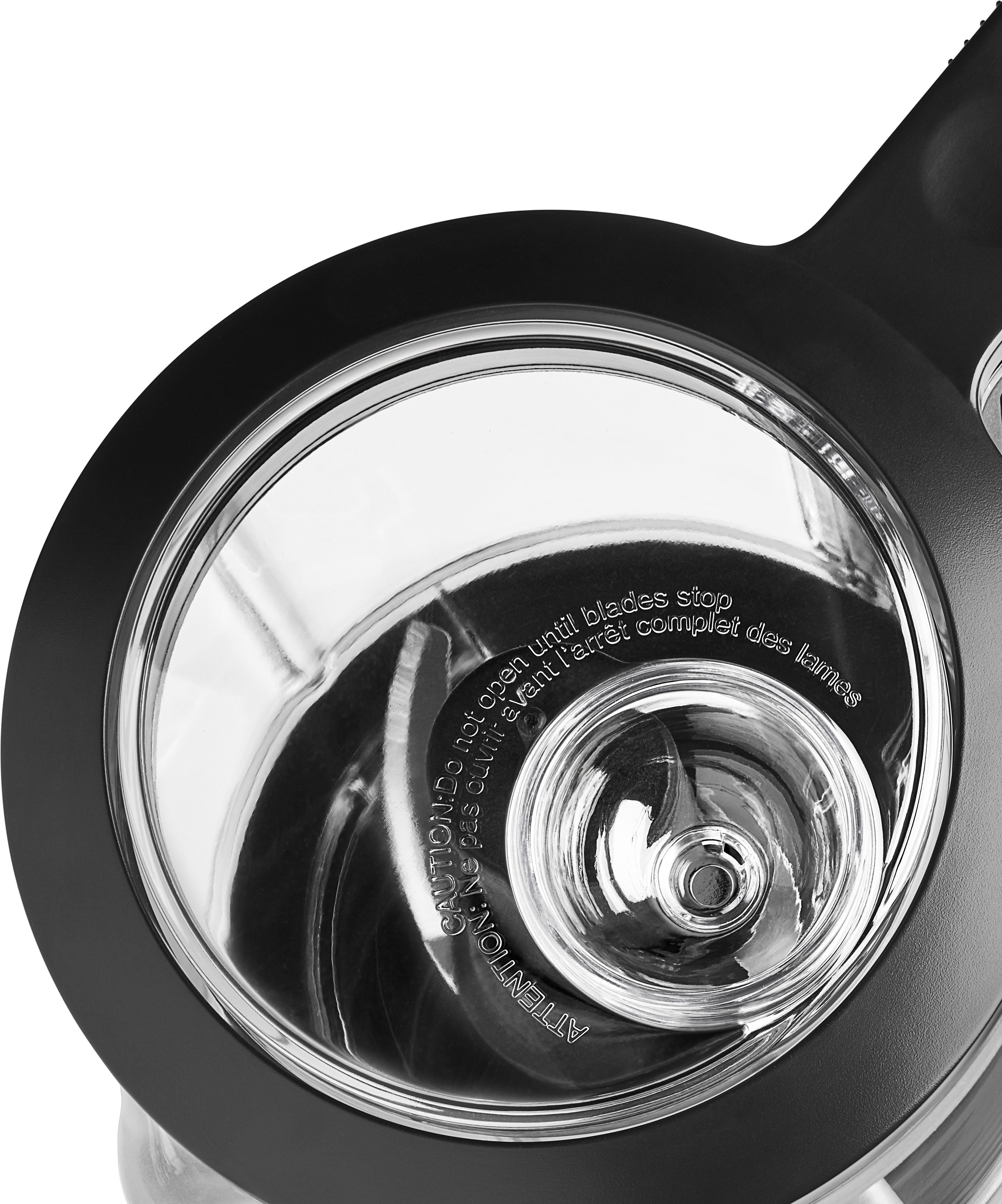 Nahaufnahme eines schwarzen Mixers, der den transparenten, kreisförmigen Behälter zeigt.